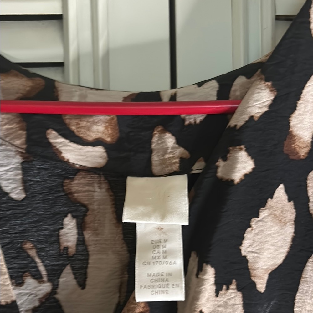 Leopard Print dress hits right below the cafe